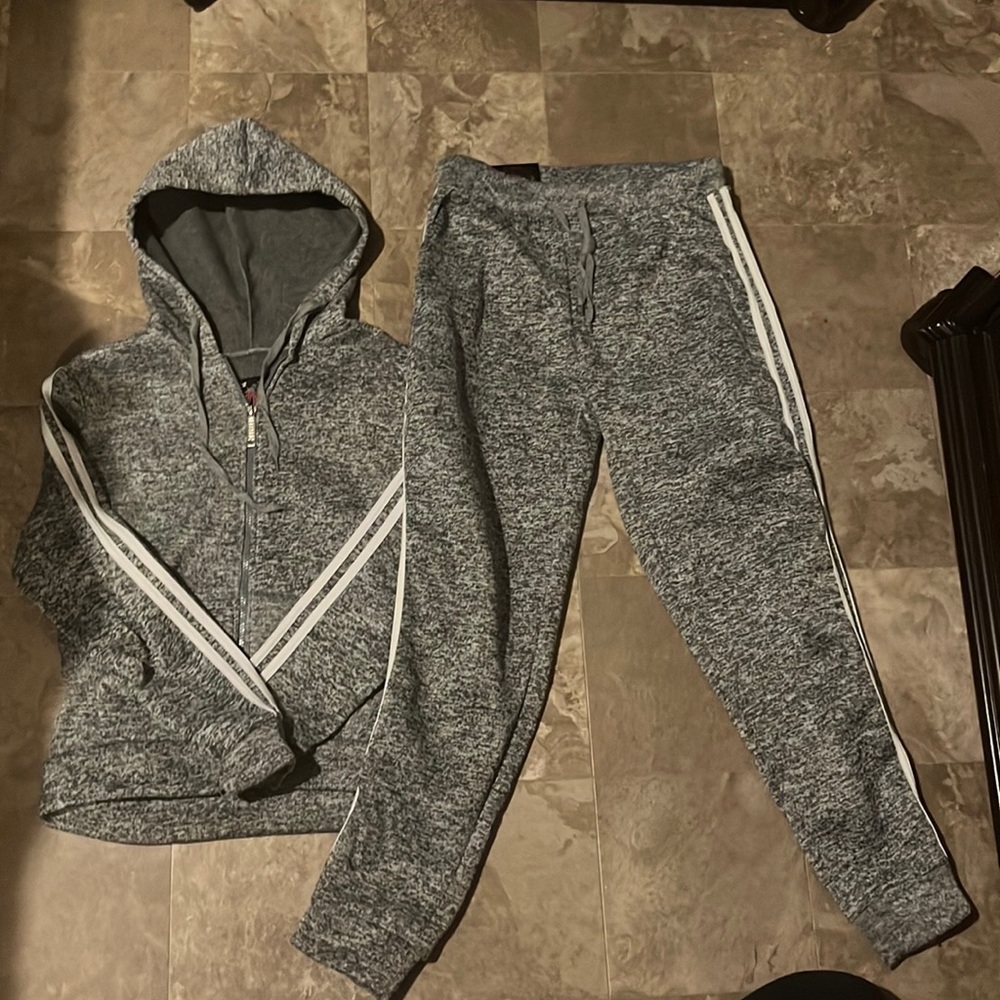 This is a grey sweat suit that has never been worn